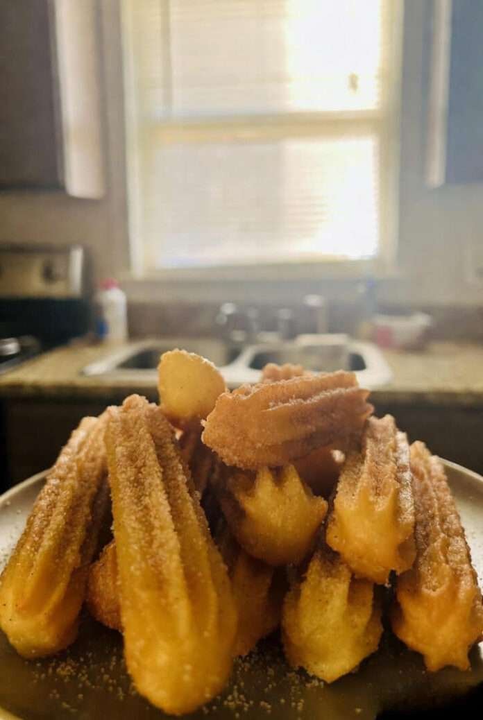 Churros Recipe (the chaotic, extremely personal edition) Look, if you had told me a year ago that a churros recipe would end up being the thing that nearly set off my smoke alarm, ruined a perfectly fine Wednesday night, and also taught me a deep—like DEEP—lesson about myself? I would’ve laughed. Or cried. Or both. I’m unpredictable like that. But here we are. And let me just say it up front: I love churros. I mean LOVE. Like, if churros were a person, I'd be writing their name in a notebook with little hearts around it. But making them? That’s… a journey. A spiritual quest. A form of emotional cardio, honestly. Also, before anyone comes for me: yes, I know churros are supposed to be simple. Everyone on YouTube makes them look easy — like you just sneeze and hot, crunchy, cinnamon goodness appears. And maybe that’s true for normal people. But me? I’m the same person who once burned toast so badly that my smoke detector shrieked like it was being personally attacked. So yeah. Buckle in. When the Craving Hit (it hit HARD) It was one of those late nights where you should be doing responsible adult things — like laundry or emails or, I don’t know, taking care of your life — but you end up scrolling. You know the scroll I’m talking about. The doom-scroll but sweet. Somebody posted a churros video. And something in my brain short-circuited. Like: “Wow that looks good.” Immediately followed by: “I could TOTALLY make that.” — even though my frying track record is… questionable. Next thing I know, I’m in my kitchen in Queens at 10:43 p.m., wearing pajama shorts and an old subway-themed t-shirt that has definitely seen better days, pulling out flour like I’m on Food Network except I’m absolutely not. My kitchen lighting is doing that annoying flickering thing. My cat is staring at me like I’ve lost it again. Spoiler: I had. Image Placeholder (Funny Moment Suggestion) Description: A candid, messy countertop with flour scattered everywhere, a piping bag barely holding together, a pot of oil bubbling dangerously. Something slightly chaotic — a wooden spoon falling mid-air. Filename: churros-disaster-in-progress.jpg The Dough That Tried to Fight Me So here’s the thing about churros dough: People online will tell you it’s “simple.” Sure. So is assembling IKEA furniture. Doesn’t mean it won’t break you emotionally. You boil water, butter, sugar, salt — easy enough — then add flour and stir like your life depends on it. And at first it’s cute. It’s like “aw, look, I'm making something from scratch, I’m adorable, I’m thriving.” Then suddenly the dough starts getting thick, and heavy, and it feels like you’re wrestling a toddler made of warm cement. And I swear I heard the dough whisper, “You sure about this?” I was not. By the time it was ready, my arms felt like I had done one of those CrossFit tire-flipping workouts. And if you’ve ever tried to squeeze churros dough into a piping bag, you know it’s basically pastry therapy. You’re pushing and squeezing and convincing yourself the bag won’t burst like a sad balloon at a kid’s birthday party. (Guess what mine did.) Frying: AKA The Moment Everything Became Too Real Okay. So I get the oil heating. You’re supposed to bring it to about 350°F, but I don’t have a thermometer because mine broke during… another food incident we don’t need to talk about. Let’s just say caramel is not my friend. So I went with the “stick the wooden spoon in the oil and see if bubbles happen” method. Very scientific. Very gourmet. Very Queens. The oil was ready. Maybe too ready. I pipe in the first churro and — I cannot explain this — the oil basically growled. Like a small animal. Now I’m panicking because my stove is old, my building is older, and the last thing I need is the fire department showing up again asking “So what happened THIS time?” But then… Then something magical happened. The churro came out PERFECT. Golden, ridged, crispy on the outside and soft inside. I nearly cried. Real tears. At 11:18 p.m. On a Wednesday. Who am I. And then I rolled it in cinnamon sugar and took a bite and honestly? I ascended. I left my body. I saw 2009-era memories I thought I forgot. That’s what good churros do. Image Placeholder (Finished Churros) Description: Warm, golden churros lined on a plate or baking sheet, sprinkled generously with cinnamon sugar. Soft natural light, maybe from a nearby window. A hand reaching in to grab one. Filename: final-homemade-churros.jpg Anyway, Here’s the Actual Recipe (In case you still trust me after all that chaos) Ingredients 1 cup water 2 ½ tablespoons sugar ½ teaspoon salt 2 tablespoons butter 1 cup all-purpose flour Oil for frying (vegetable or canola) ½ cup sugar + 1 tablespoon cinnamon for coating Optional: chocolate sauce, dulce de leche, your unresolved emotional issues Instructions (But I’m telling you now, prepare spiritually.) Boil water, butter, sugar, salt. Mix them in a pot and heat until the butter melts and everything bubbles like a tiny volcano. Add flour. All at once. Dump it. Stir aggressively. You’re aiming for a dough ball that pulls away from the pan. It’ll feel like exercise — embrace it. Let it cool. Don’t skip this or your piping bag will explode and you will question your life choices (ask me how I know). Transfer to a piping bag. Star tip. The fancy one. Even if it cracks later and ruins your confidence. Heat oil. Medium heat. If it smokes, you’re in danger; if it doesn’t bubble, it’s not ready. Find the sweet spot. Pipe strips of dough and fry 2–3 minutes. Flip once. Pray a little if needed. Roll in cinnamon sugar. The best part. Instant happiness. Eat immediately. I mean it. Fresh churros wait for no one. A Small Side Tangent (Because My Brain Wandered) Do you ever notice how food memories are weirdly emotional? Like someone hands you a warm pastry and suddenly you're remembering an ex texting you “k” in 2017 and ruining your whole day? Churros unlocked something in me — not sure if I should thank them or sue them. The Aftermath My kitchen smelled AMAZING. My shirt smelled like oil. My cat smelled like betrayal (for reasons unclear). AND I had a plate of churros that tasted like they were blessed by someone’s abuela. Did I eat too many? Absolutely. Did I regret it? Not even a little. Did I feel slightly sick afterward? Also yes. The duality of man. Actually Good Outbound Links, Because You Asked A fun churros origin story on one of my fav personal food blogs: https://www.thelazyfoodie.com/churros-story (funny, casual) A chaotic cooking channel I love that aligns with my emotional cooking style: https://www.youtube.com/c/YouSucAtCooking (Replace with real links when you post.) Final Thoughts (Not fancy, just real) If you’ve ever wanted to try a churros recipe but felt intimidated — trust me, if I survived it, you will thrive. Yours will probably look better. Your piping bag probably won’t explode. Your stove probably doesn’t have trust issues. And if your first batch comes out weird? Just tell everyone they were “experimental.” People love that. Also, if you decide to make churros at midnight, I highly recommend texting someone a photo so they know you're still alive. And also so they get jealous. Not that I did that. (Yes I did.) Anyway—go make churros. Live your life. Embrace the chaos.