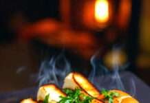 Masala Pav Recipe: The Spicy, Buttery Street Food I Crave at 2AM masala pav on a street-style tawa, bright reds and oranges of the masala glowing under warm streetlight-like lighting